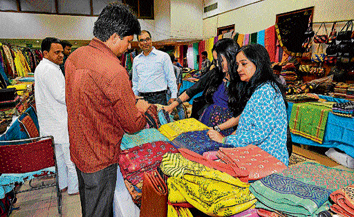 Colourful: Shoppers throng the exhibition focusing on MP's weaves and handicrafts.