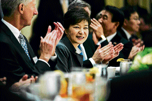 Something Extra: President Park Geun-hye of South Korea is applauded at an event in Washington. NYT