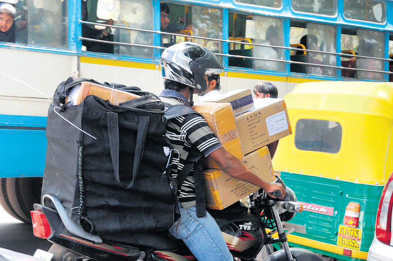 Deplorable: It's common to see heavily-loaded two-wheelers in the City. DH&#8200;PHOTO BY S K DINESH