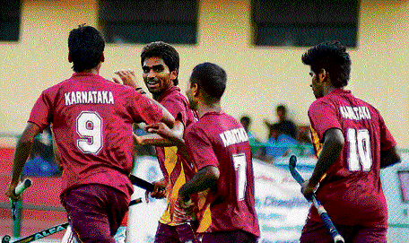 Elated bunch: Vinayak Bijawad (second from left) of Karnataka celebrates with team-mates after scoring against Punjab during their match in Bangalore on Tuesday. dh photo