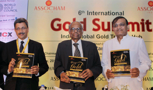 Chairman, Economic Advisory Council to the Prime Minister, C. Rangarajan releasing a souvenir at the '6th International Gold Summit' in New Delhi on Wednesday. ASSOCHAM President R N Dhoot (R) and Somasundaram P R (L), MD, World Gold Council(WGC), are also seen. PTI Photo