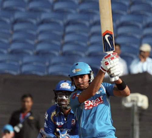 Manish Pandey of Pune Warriors plays a shot against Mumbai Indians during an IPL-6 match in Pune on Saturday. PTI Photo