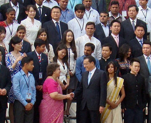 Chinese Premier Li Keqiang poses for a photo with a 100-member Indian Youth delegation at the Zhongnanhai in Beijing on Tuesday. PTI Photo