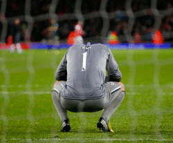 Wigan Athletic goalkeeper Joel Robles reacts after his side lost 4-1 to Arsenal, in their English Premier League soccer match at the Emirates Stadium in London, May 14, 2013. The result means Wigan are relegated from the Premier League. REUTERS
