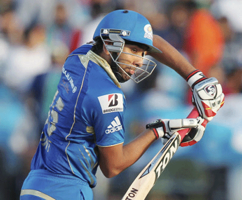 Mumbai Indians captain Rohit Sharma plays a shot against Pune Warriors during their IPL-6 match in Pune on Saturday. PTI Photo