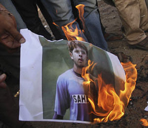 ndian cricket fans burn a picture of Indian cricketer Shanthakumaran Sreesanth at a protest during the Indian Premier League (IPL), in Ahmadabad, India, Thursday, May 16, 2013. Police arrested three Indian cricketers, including Sreesanth, over allegations of spot-fixing, involving performing in a pre-determined way at set times for the benefit of gamblers, during a domestic Twenty20 game. AP Photo