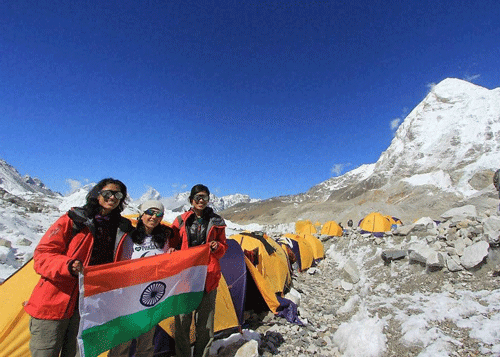 File Photo- Tashi and Nancy Malik, 21, twins from Dehradun hold national flag. The sisters have scripted history by becoming the first twins ever to conquer the summit of Mount Everest together. PTI Photo