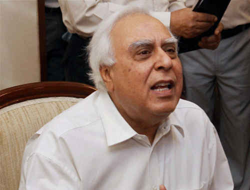Kapil Sibal addressing the media after taking additional charge of Law Ministry in New Delhi on Monday. PTI Photo