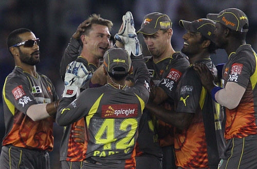 Sunrisers Hyderabad's bowler Dale Steyn (2 L) celebrates with teammates after taking wicket of Kings XI Punjab's batsman Mandeep Singh during an IPL6 match in Mohali on Saturday. PTI Photo