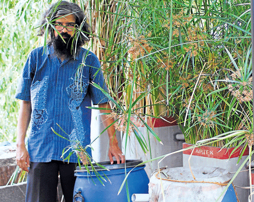 beating scarcity: Vishwanath displays the equipment used to recycle water. dh photo