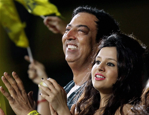 Actor Vindoo Dara Singh with Chennai Super Kings Skipper MS Dhoni's wife Sakshi watches an IPL T20 match in Chennai in April 2013. Singh has been arrested by the Mumbai Police for his alleged links with bookies accused of spot-fixing in the IPL's on-going edition. PTI Photo