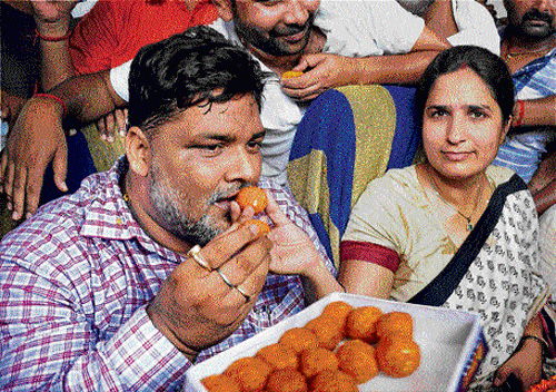 Former RJD MP Rajesh Ranjan alias Pappu Yadav is offered sweets by his wife Ranjita Ranjan after his release from jail.