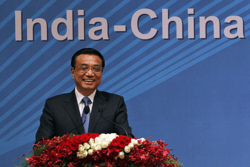 Chinese Premier Li Keqiang smiles during a business summit in Mumbai, India, Tuesday, May 21, 2013. Li told Indian business leaders Tuesday that developing stronger economic ties between their two nations would have huge benefits for both sides. AP