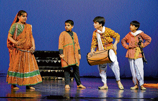Dramatic: Children (above and below) enacting the play Gopi Gavayya Bagha Bajayya.
