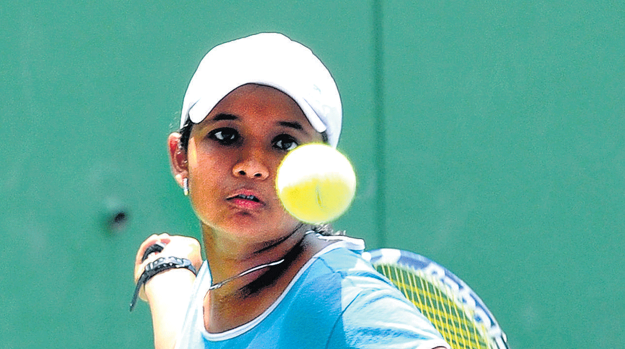 Poised to strike: Tanvi Bhat Hattangadi sets up a forehand return during her win over Bhavya Ramineni in the ATF under-14 Asian Junior ranking tournament. DH&#8200;PHOTO
