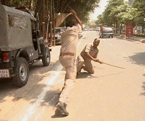 Two police men engaged in a fight after a verbal spat in Lucknow on Wednesday. PTI Photo