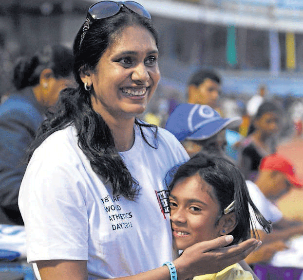 Making mama proud : Olympic heptathlete Pramila Aiyappa congratulates her daughter Unnathi after the youngster won the 200M gold in the under-9 category. DH&#8200;PHOTO