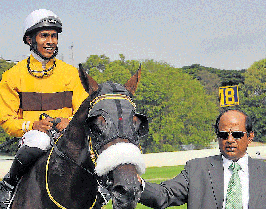 Easy win : Trainer S Ganapathy (right) with his colt Murioi  (B Sreekanth up) after winning the Nanoli Stud Juvenile  Million in Bangalore on Sunday. dh photo