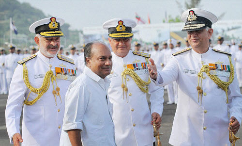 : Defence Minister AK Antony arrives to attend the passing out ceremony of the 84th batch of cadets of the Indian Naval Academy at Ezhimala in Kannur on Saturday. Chief of the Naval staff Admiral DK Joshi (L), Vice Admiral Satish Soni (C) and Vice Admiral Pradeep Chauhan are also seen. PTI Photo