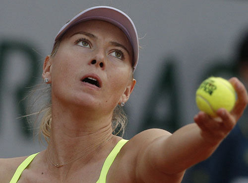 Russia's Maria Sharapova serves against Su-Wei Hsieh of Taipei in their first round match of the French Open tennis tournament, at Roland Garros stadium in Paris, Monday, May 27, 2013. AP Photo