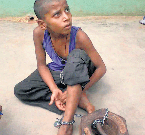 10-year-old boy Tauhit who was bound to a 20 kg weight by chain at a madrasa in Malavalli. dh photo