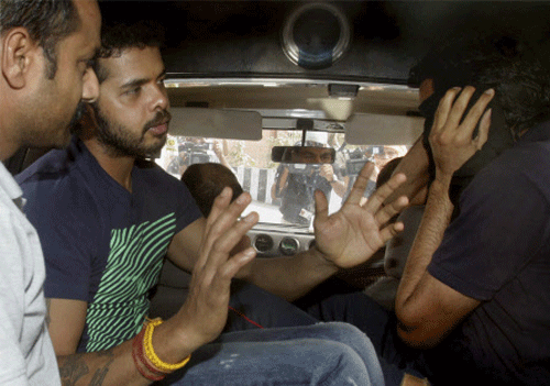 Cricketer S Sreesanth and other accused after being produced at Saket court in New Delhi on Tuesday in connection with IPL spot-fixing case. PTI Photo