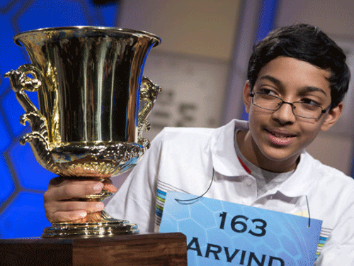 Arvind Mahankali, 13, of Bayside Hills, N.Y., holds the championship trophy after he won the National Spelling Bee by spelling the word 'knaidel' correctly on Thursday, May 30, 2013, in Oxon Hill, Md. AP Image