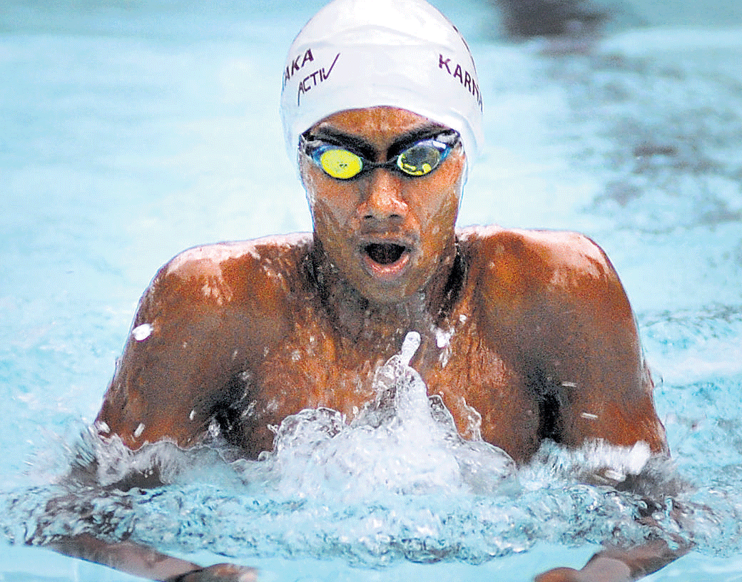 Fine effort: BAC's Likith SP en route winning the gold in the boys' Group I 50M breaststroke in Bangalore on Friday. Likith set a new meet record with a timing of 31.22 seconds. dh photo