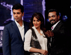 Karan Johar, Madhuri Dixit-Nene and Remo D'Souza during a TV reality show, in Mumbai on Monday night. PTI Photo