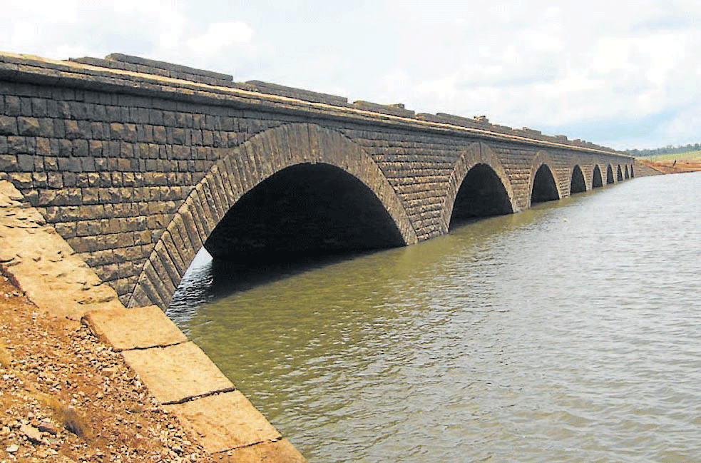 Back to life: A view of Thadasa bridge which has surfaced from its watery grave in Narasimharajapura. DH Photos