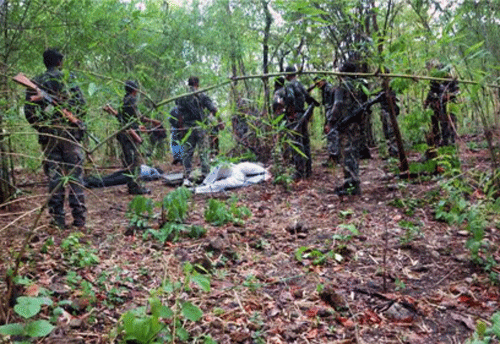 Security personnel inspect the site of Maoists' ambush on Sunday in Bastar where the Congress party's convoy was attacked. PTI Photo