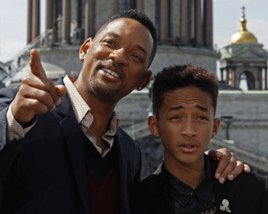 U.S. actor Smith and his son pose for pictures in front of Saint Isaac's Cathedral during a photo call to promote their latest movie 'After Earth' in St. Petersburg. Reuters