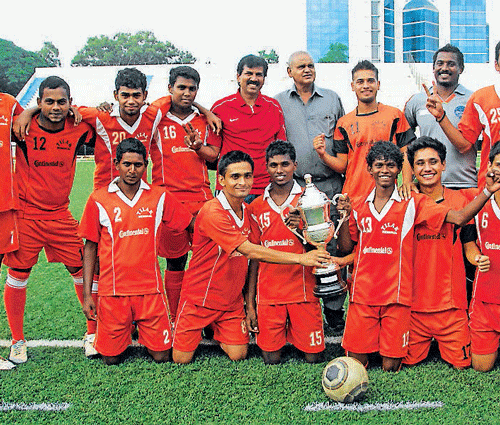 champions Tilak Memorial, winners of the BDFA 'B' Division league, STANDING (from left): Manivannan (manager), Kiran V, Marvin, Bharath, Jeevan, Krishna (coach), Sampath, Binay, Ruben, Jaydev, Naveen Babu, S Venkatesh. KNEELING: Pradeep Kumar, Akhilesh, Kiran M, Milton, Raja, Abhilesh, Manjesh. DH PHOTO