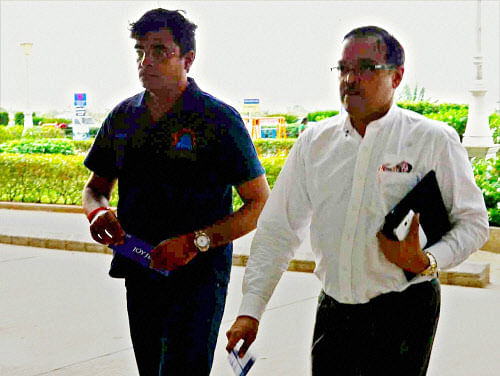 Chennai Super Kings' owner Gurunath Meiyappan along with his lawyer at Madurai Airport, on Friday. PTI Photo