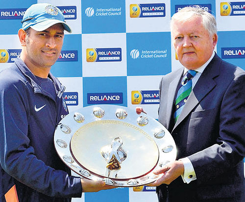 on top of the world India skipper MS Dhoni (left) receives the ICC ODI Championship Shield from ICC chief David Morgan in Cardiff on Monday. pti