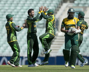 Pakistan's Junaid Khan, second left, celebrates taking the wicket of South Africa's Hashim Amla, fourth left, during a warm up cricket match for the upcoming ICC Championship Trophy between Pakistan and South Africa at The Oval cricket ground in London, Monday, June 3, 2013. The first game of the tournament takes place in Cardiff on Thursday. AP Photo