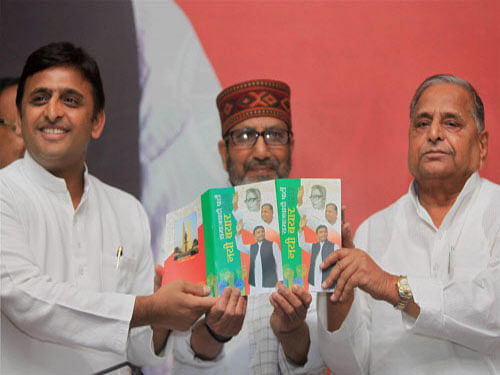 File image: SP supremo Mulayam Singh Yadav with Uttar Pradesh Chief Minister Akhilesh Yadav releasing a book of a party activist during a press conference in Lucknow on Tuesday. PTI Photo