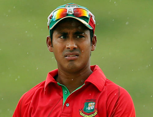 FILE- In this March 25, 2013 file photo, Bangladesh's Mohammad Ashraful reacts as the play is interrupted by rain during the second one-day international match against Sri Lanka in Sooriyawewa, Sri Lanka. The Bangladesh Cricket Board said Tuesday, June 4, 2013 former national team captain Ashraful has been suspended from all forms of the game during an investigation into alleged match-fixing in this year's domestic Premier League tournament. (AP Photo/