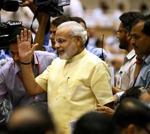 Chief Minister of Gujarat, Narendra Modi, center, arrives to attend a conference of the chief ministers of various states on Internal Security in New Delhi on Wednesday, June 5, 2013. AP Photo