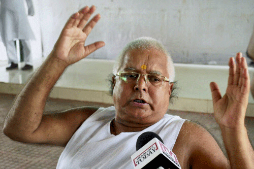 RJD Chief Lalu Prasad talks to the media after his party candidate Prabhunath Singh wins by-election at the Maharajganj Lok Sabha seat in Patna on Wednesday.PTI Photo