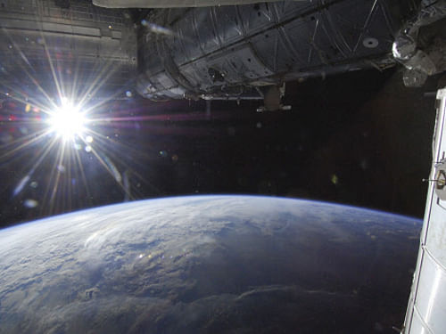 File image: The sun is captured over Earth's horizon by one of the Expedition 36 crew members aboard the International Space Station, as the orbital outpost was above a point in southwestern Minnesota in this May 21, 2013 photo courtesy of NASA. REUTERS