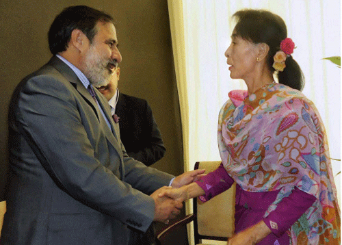 Union Minister of Commerce Industry and Textiles Anand Sharma shakes hands with Aung San Suu Kyi, Chairperson, National League for Democracy on the sidelines of World Economic Forum on East Asia at Nay Pyi Taw in Myanmar on Thursday. PTI Photo.