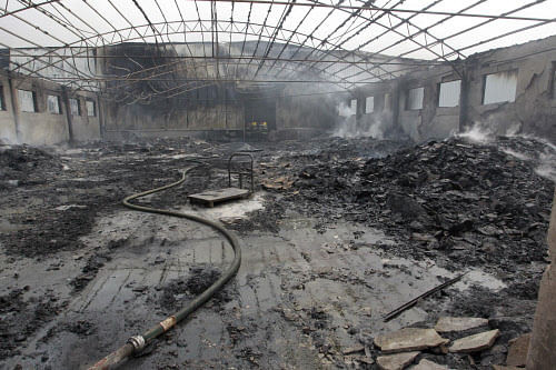 A view shows a burnt out site of a poultry slaughterhouse after a fire in Dehui, Jilin province June 3, 2013. The death toll from a fire at the poultry factory in northeast China's Jilin Province had risen to 120 as of 8 p.m. Monday, with another 70 injured, according to the rescue headquarters, Xinhua News Agency reported. Picture taken June 3, 2013. REUTERS