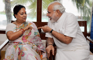 Gujarat Chief Minister Narendra Modi with former Rajsthan CM Vasundhara Raje Scindia during the BJP National Office Bearer and States President's meet, at Panaji in Goa on Friday. PTI Photo