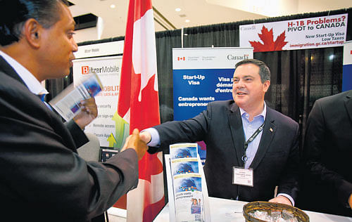 SPECIAL ATTRACTION: Jason Kenney, right, the minister of Citizenship, Immigration and Multiculturalism in Canada, greets Soyren Sarkar of Nexval Inc. at the TiEcon entrepreneur convention in Santa Clara, California. NYT