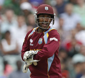 West Indies' wicket keeper Denesh Ramdin celebrates his wicket of Pakistan's Kamran Akmal during their ICC Champions Trophy group B cricket match at the Oval cricket ground in London, Friday, June 7, 2013. AP Photo