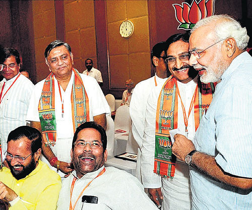 Drawing strategy: Gujarat Chief Minister Narendra Modi with BJP leaders Ramesh Pokhriyal, Mukhtar Abbas Naqvi, Prakash Javadekar and others at the party's National Executive meeting in Panaji, Goa, on Saturday. PTI