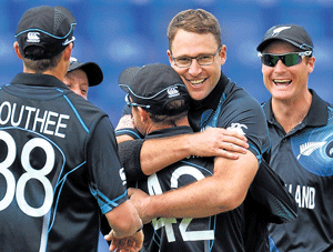 jubilant: New Zealand's Daniel Vettori (centre) celebrates with team-mates after dismissing Mahela Jayawardene . AFP