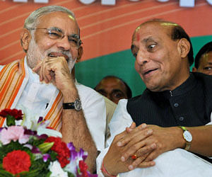 BJP President Rajnath Singh and Gujarat Chief Minister Narendra Modi during the party workers rally at Taligaun near Panaji in Goa on Sunday. PTI Photo