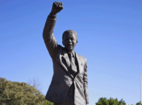 A statue of former South African President Nelson Mandela outside the Groot Drakenstein correctional facility near the town of Franschhoek, South Africa, Sunday, June 9, 2013. Former South African President Nelson Mandela was receiving medical treatment for a lung infection on Sunday after spending a second night in a hospital. AP Photo